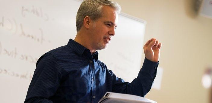 Professor Matt Bell teaching in front of a white board 